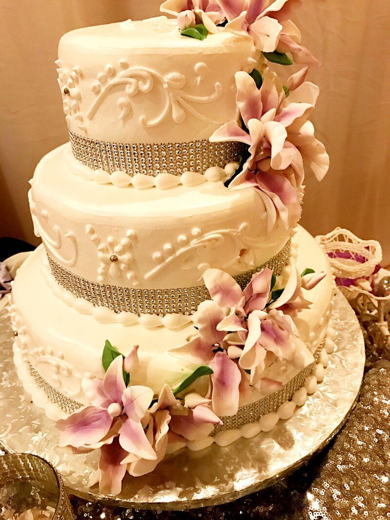 Wedding cake with white and purple flowers