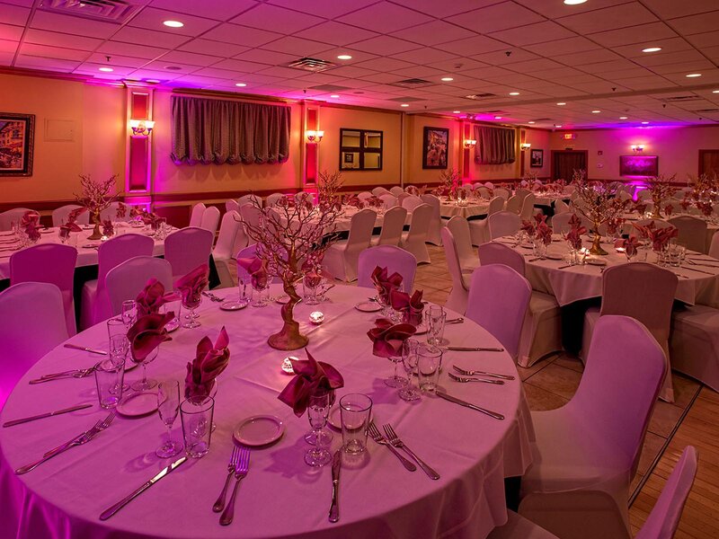 Duomo room with set tables with pink ambient lighting