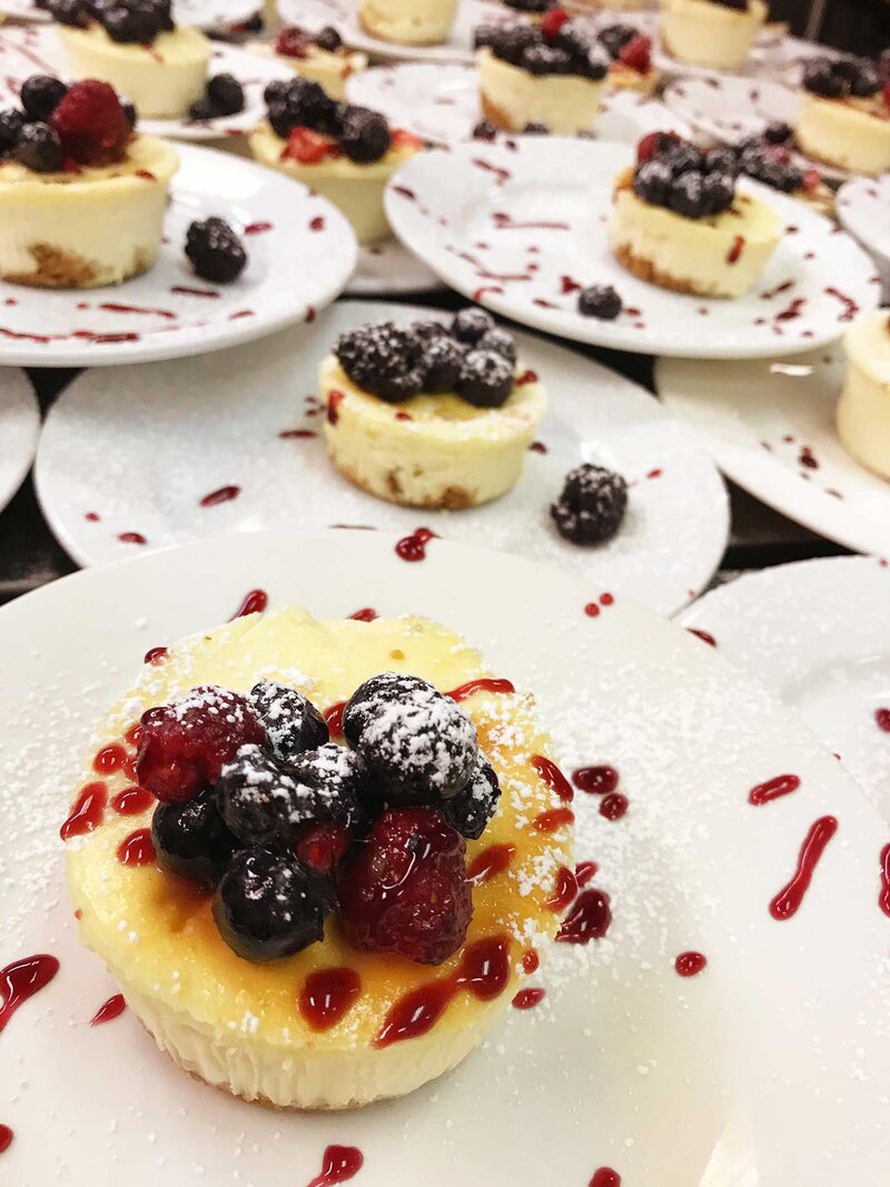 Cream cheese cupcake topped with fresh berries